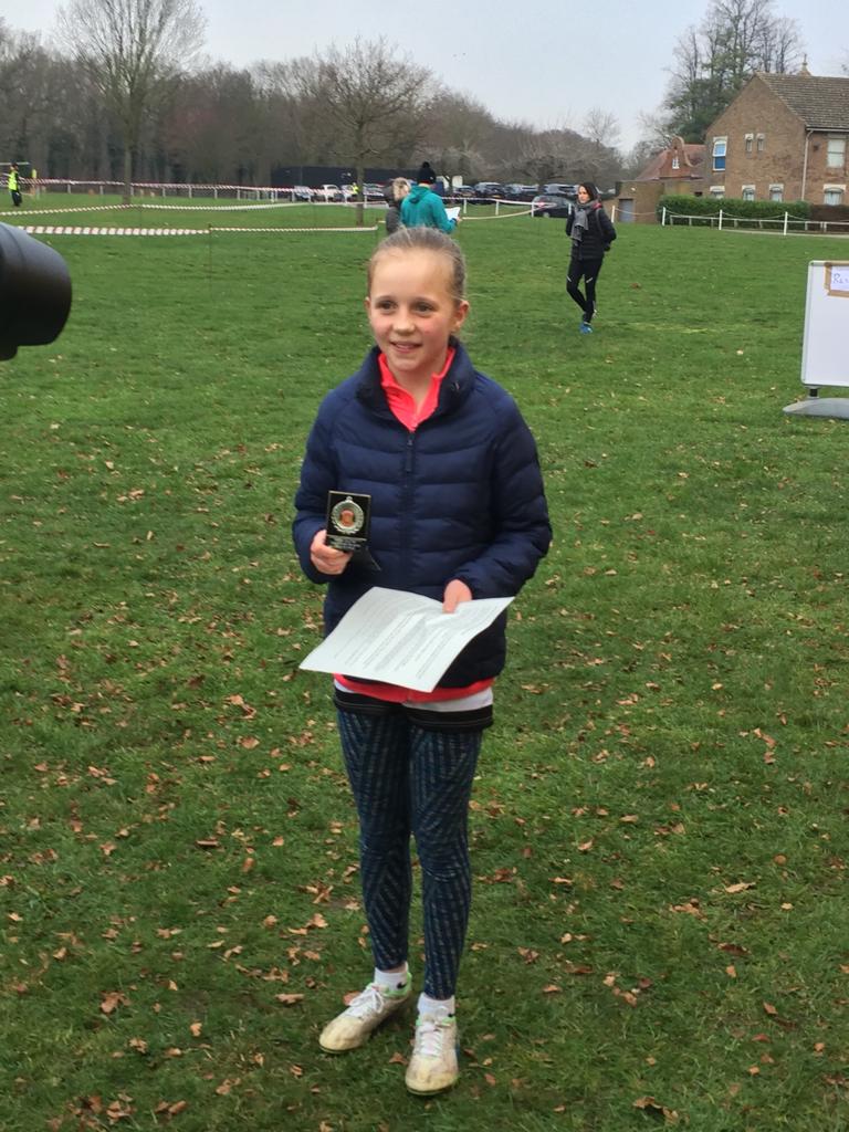 Verity with cross country medal