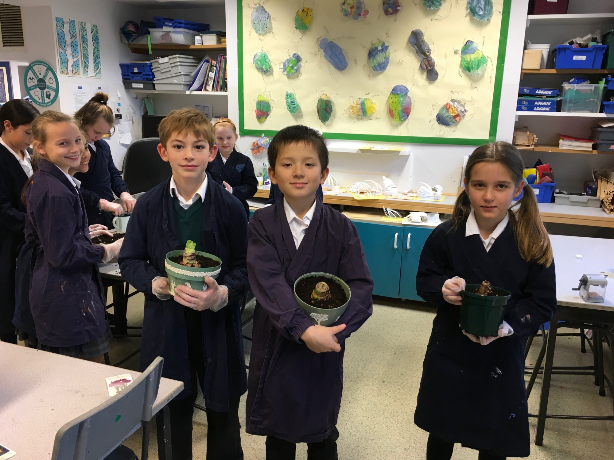 Junior School pupils with amaryllis bulbs