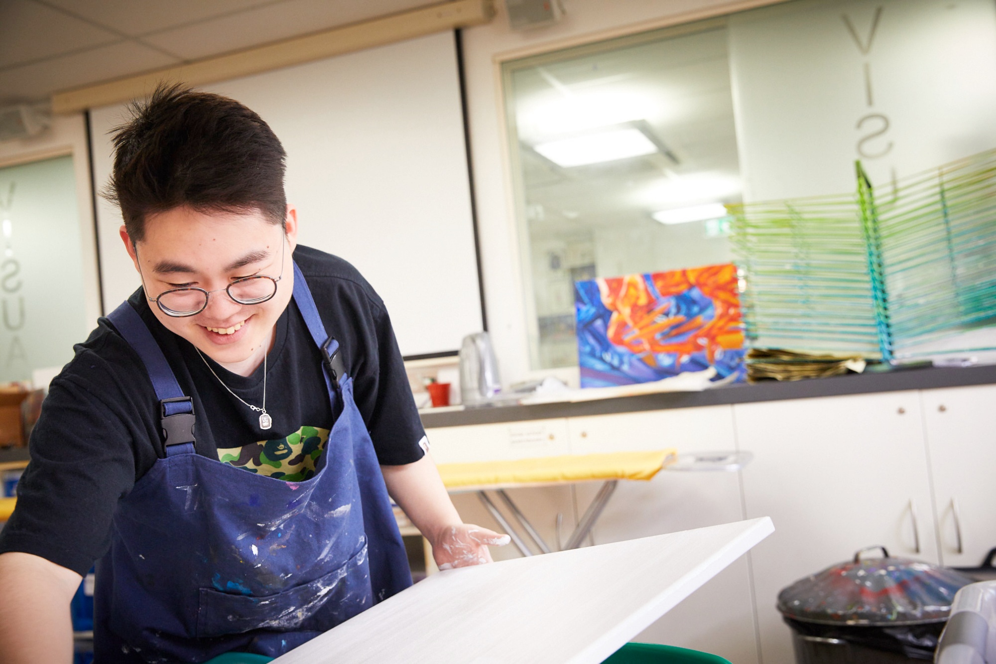 Student doing art