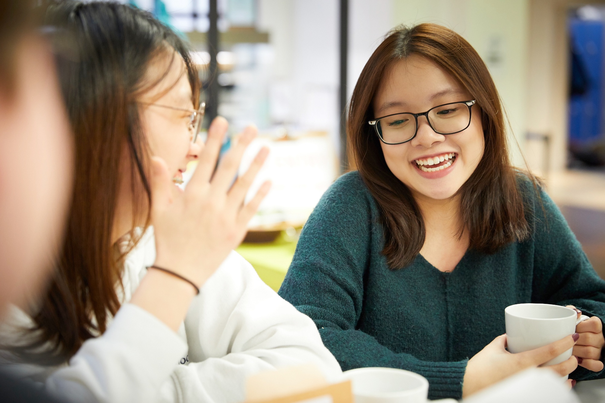 Image of students in food hall to illustrate link to 'Living overseas' page