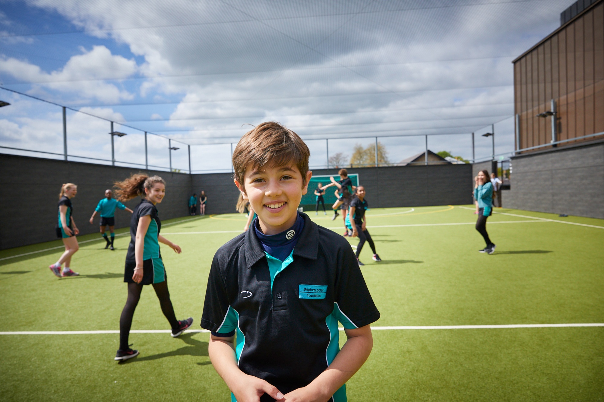 Image of student on football pitch to illustrate link to 'Events' page