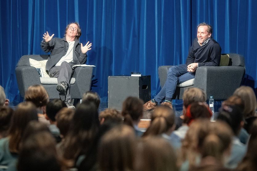 Ben and Ed talk on stage at the Senior School