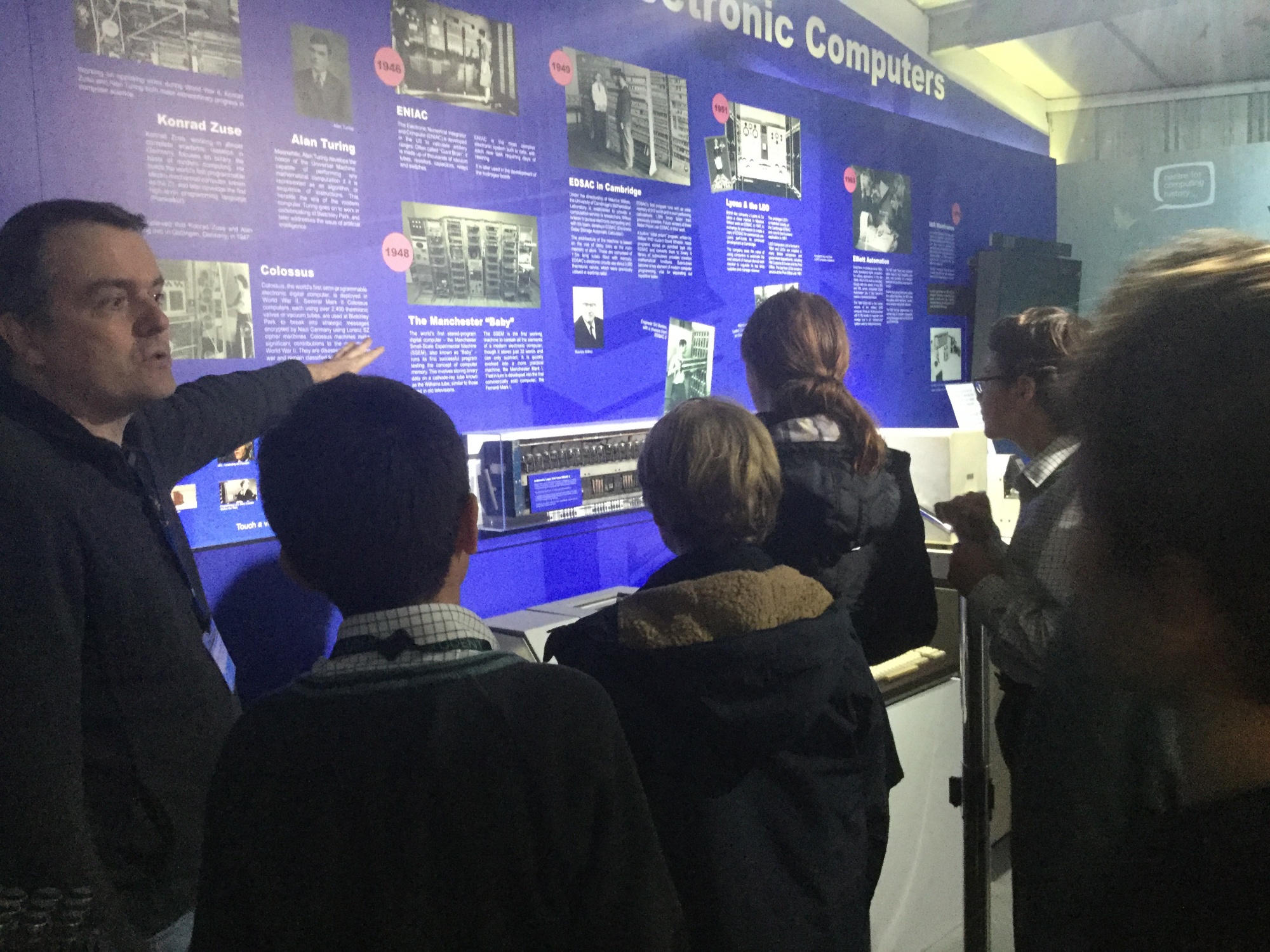 Tour guide explaining the history of computing