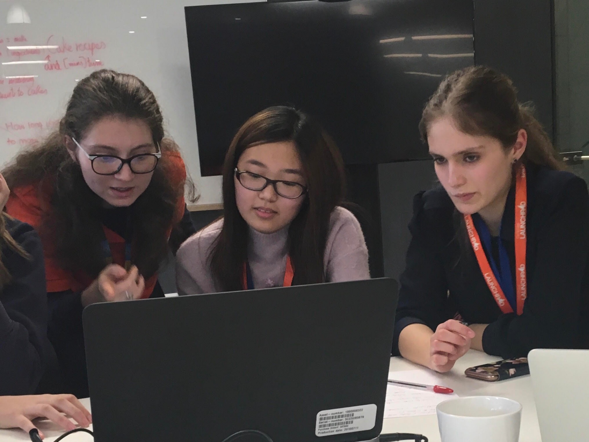Students look at a computer at Amazon