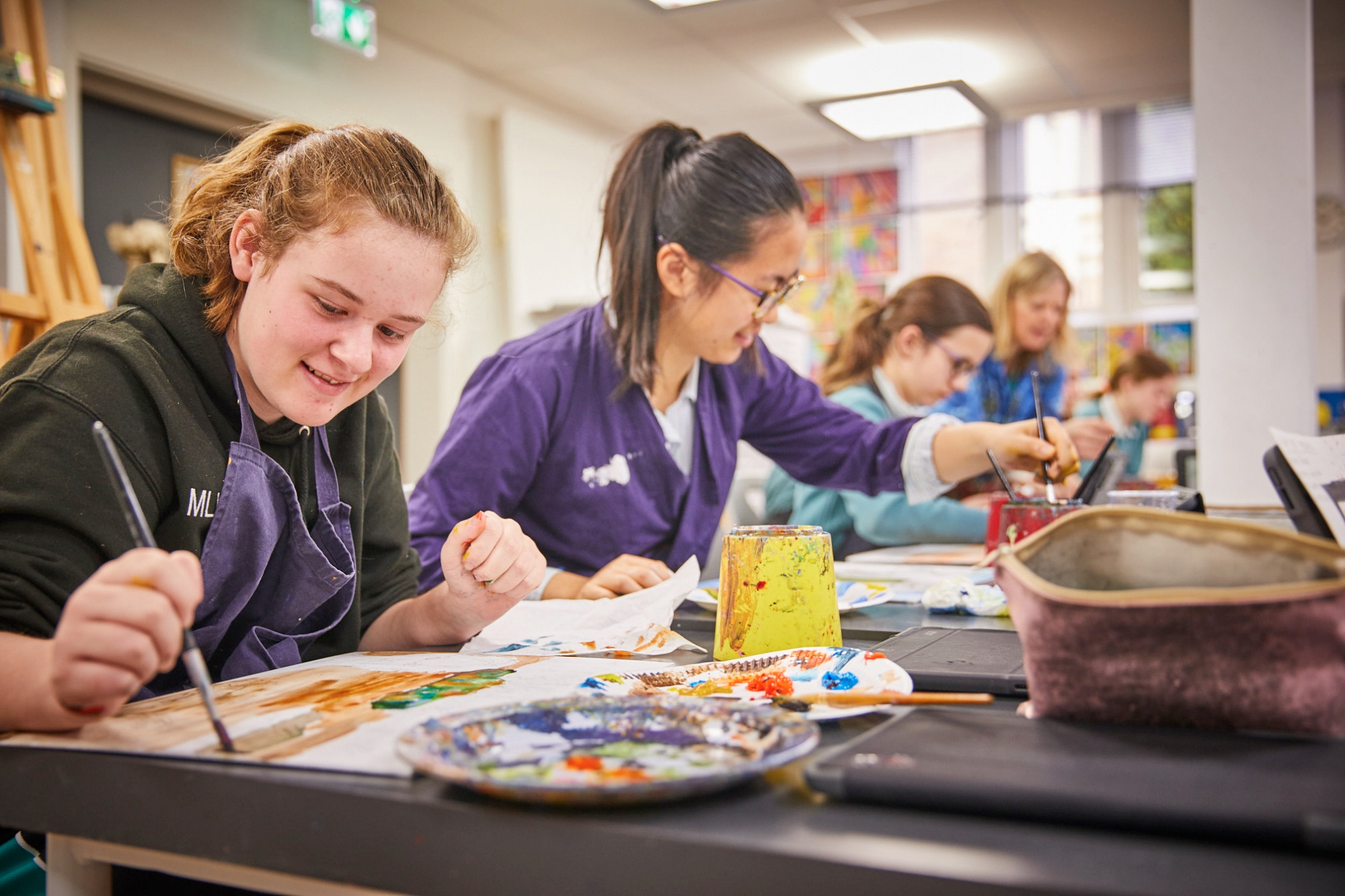 Image of students in art class to illustrate link to 'Joining us' page