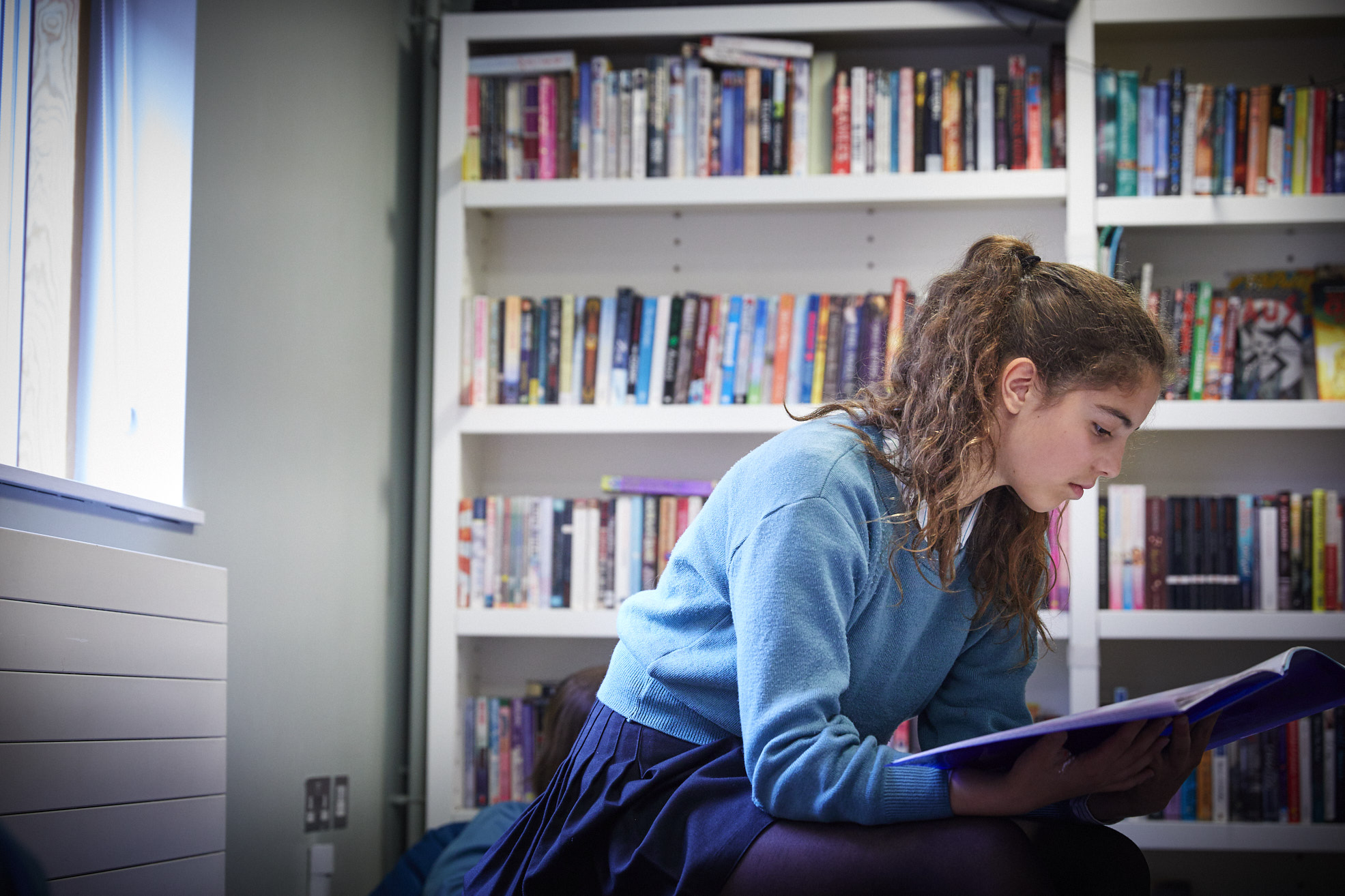 Image of student reading to illustrate link to 'Latin and classical greek' page