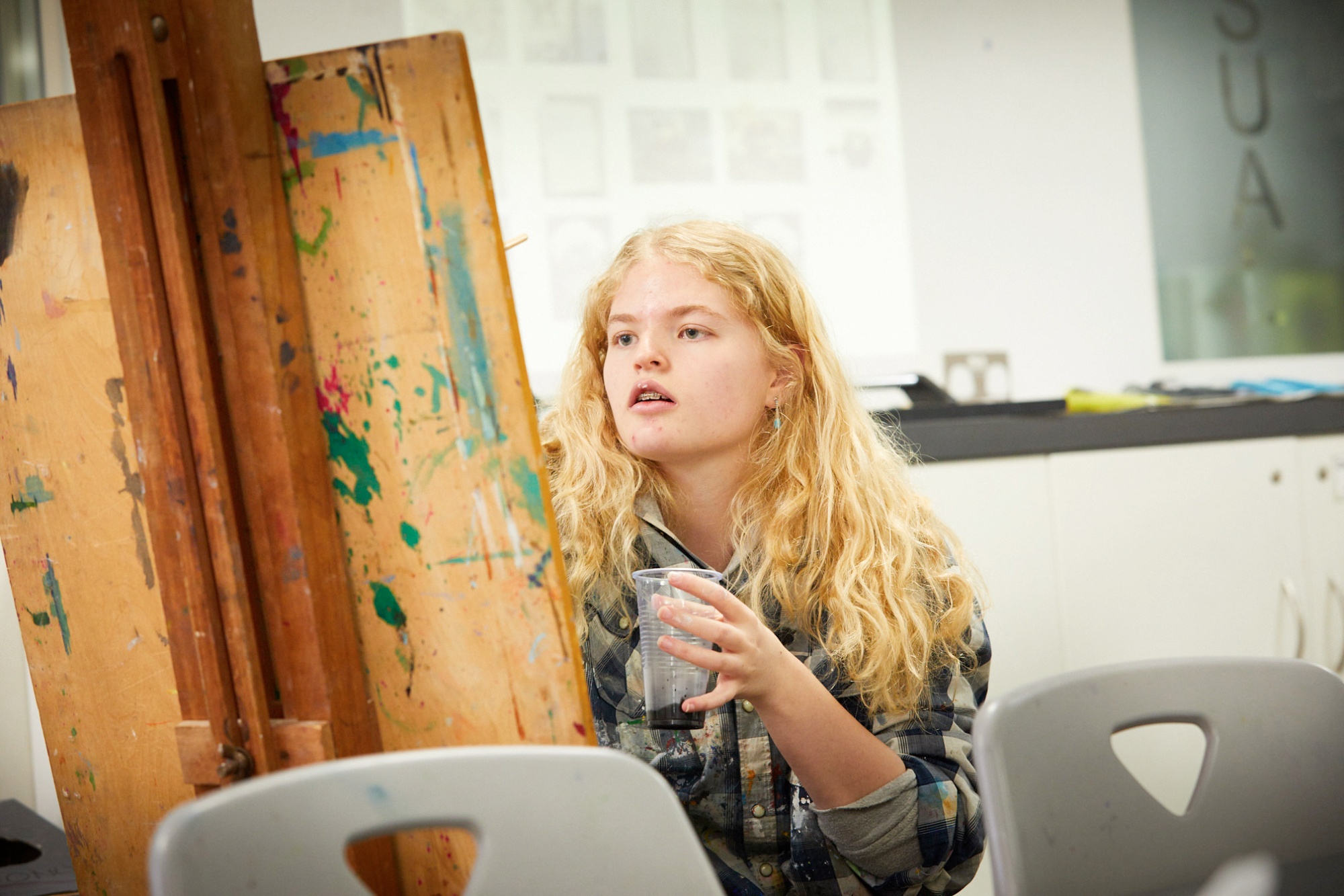 Image of student in art class to illustrate link to 'Gallery' page