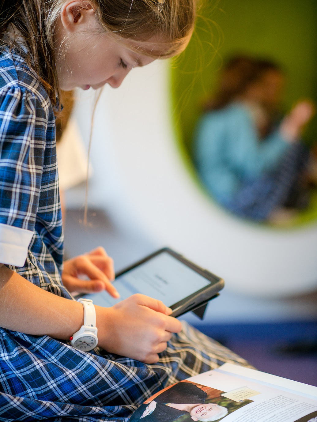 Image of pupil using ipad to illustrate link to 'digital learning' page