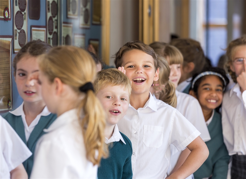 Junior school boys and girls in the corridor