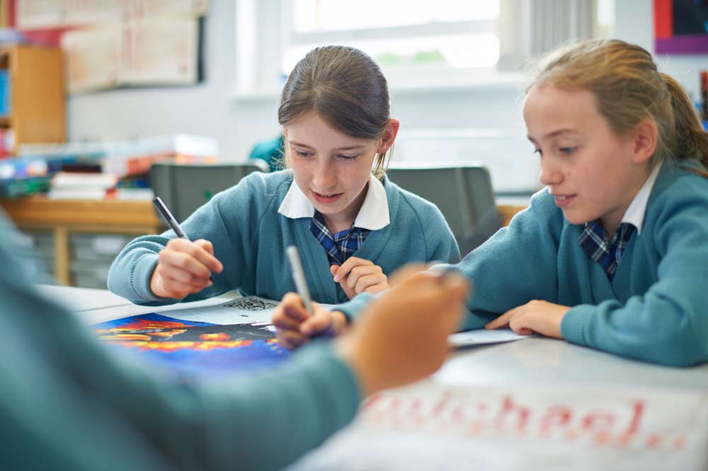 Two pupils in a classroom