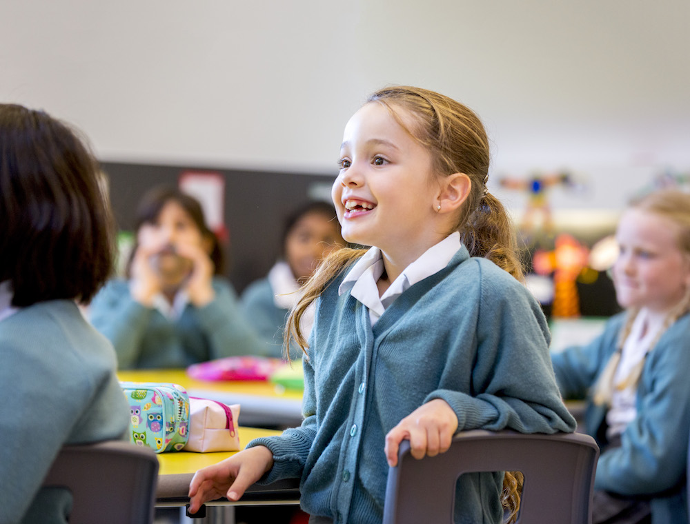 Image of pupil in class to illustrate link to 'Geography' page