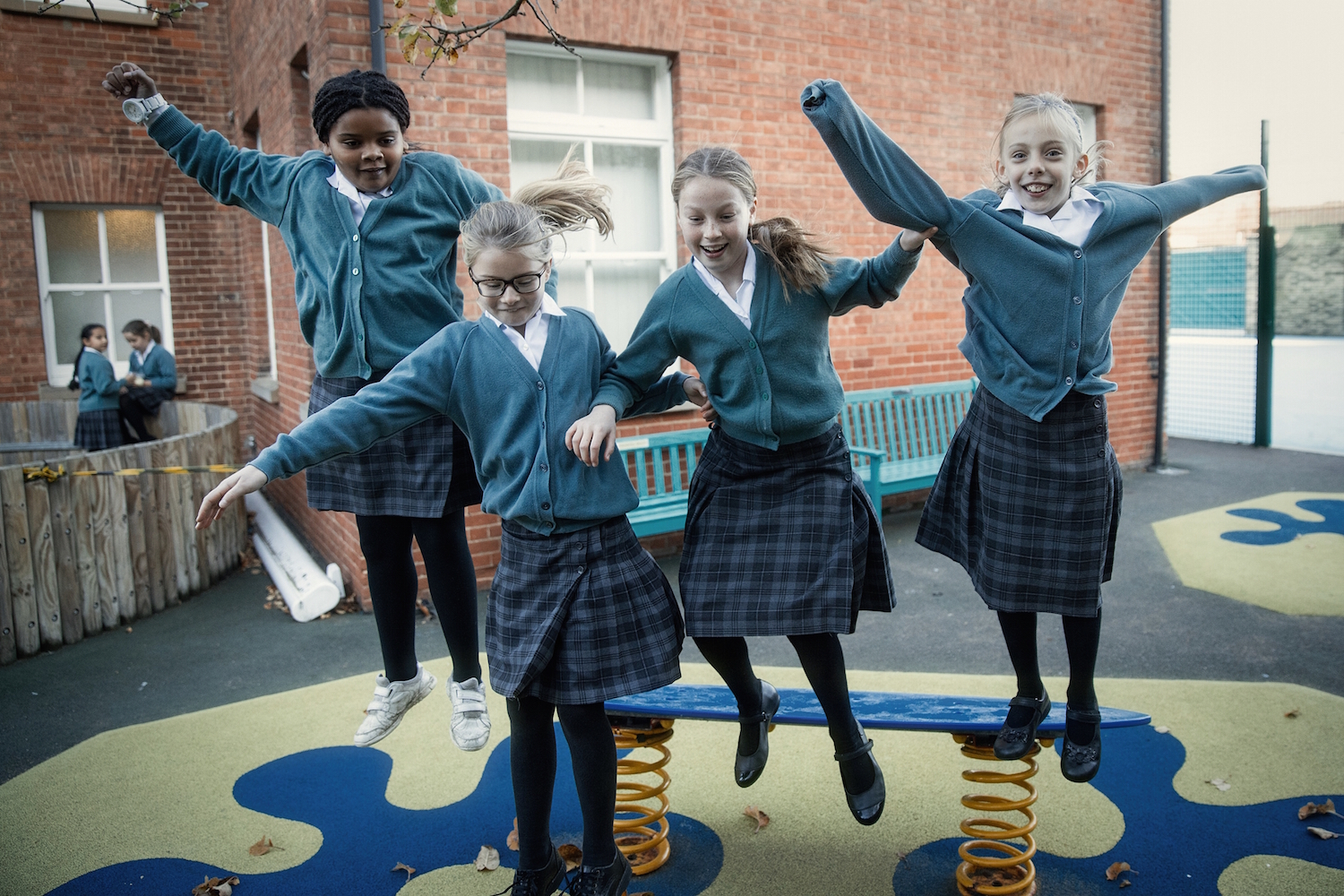 Image of pupils jumping to illustrate link to 'School calendar' page