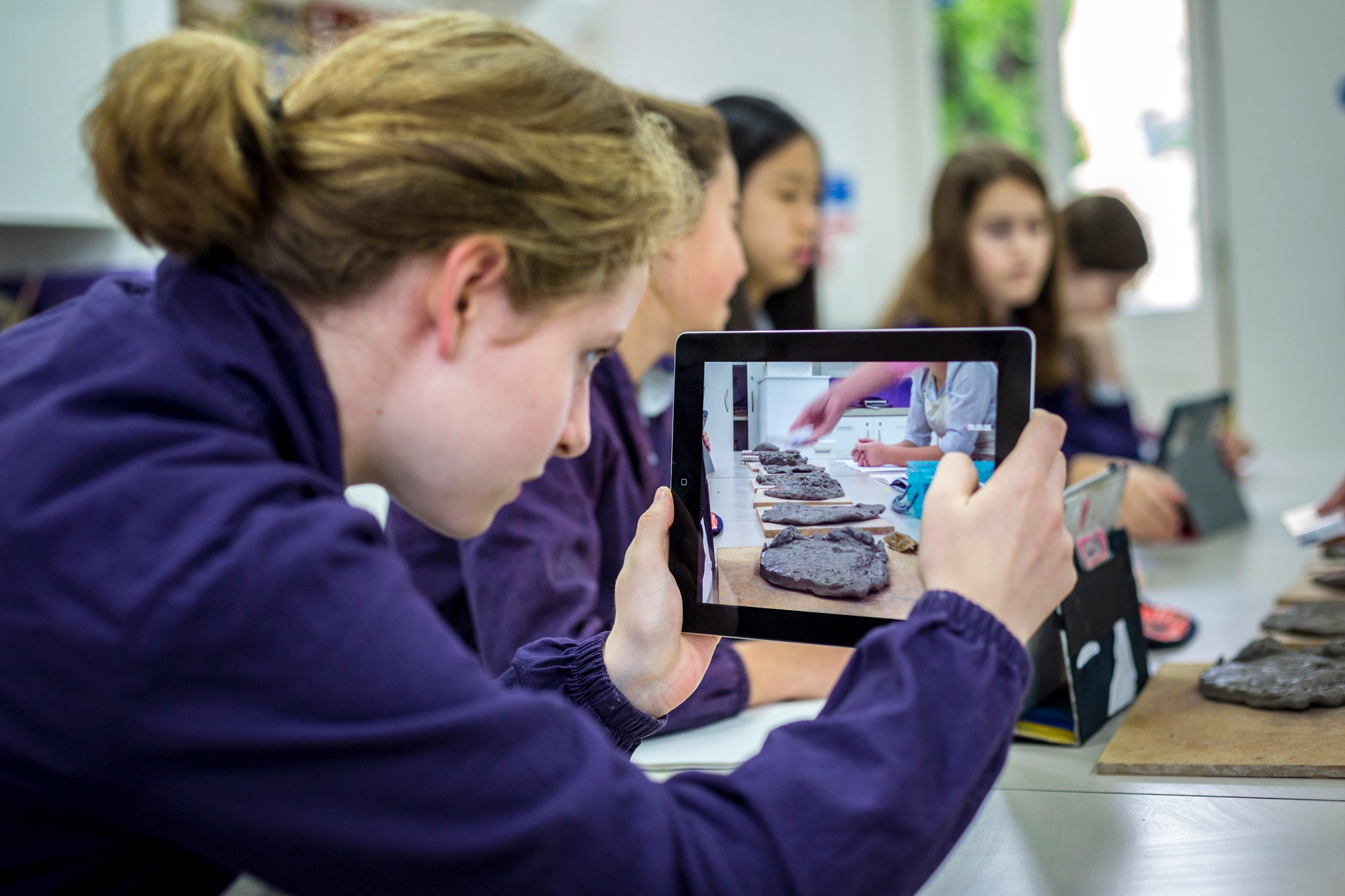 Student holding ipad