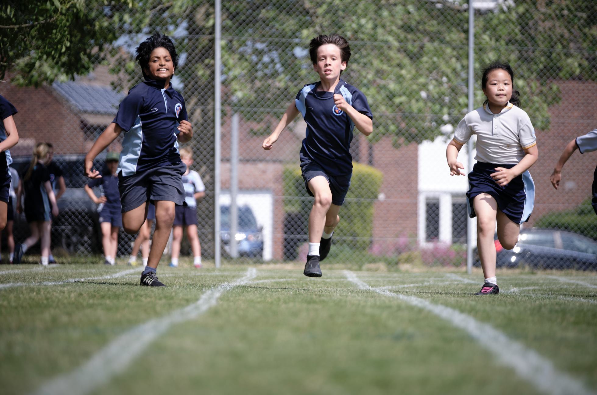 Pupils running to illustrate link to 'Dame Bradbury's Fixtures and Teams' page
