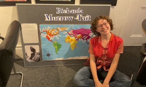 Student Alison H in front of the display to celebrate alumna Richarda Morrow-Tait