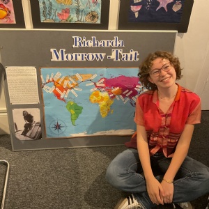 Student Alison H in front of the display to celebrate alumna Richarda Morrow-Tait