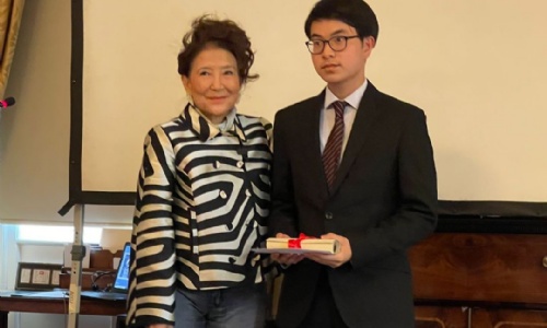 Year 12 student Lewis with Jung Chang collecting essay writing prize