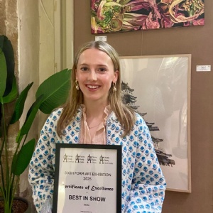 Amelia with her Arts Society Competition certificate